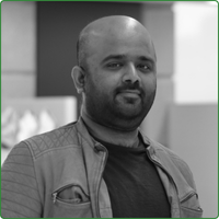 A black and white head shot of Furquan Hassan